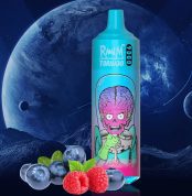 RandM Tornado 9000 vape with pink alien and brain illustration, placed beside fresh blueberries and raspberries on a space-themed background