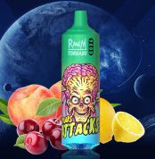 RandM Tornado 9000 green vape with Mars Attacks skull design, surrounded by peach, cherry, and lemon fruits