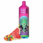 RandM Tornado 9000 disposable vape in pink with a cartoon alien skull design, accompanied by watermelon slices and colorful bubble gum balls.