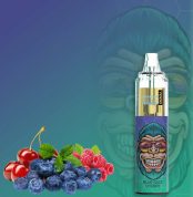 RandM Tornado 7000 Blue Razz Cherry vape with blueberries, cherries, raspberries, and mint leaves on a blue-green background